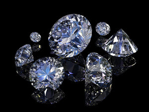 Close-up of high-resolution diamonds reflecting light.